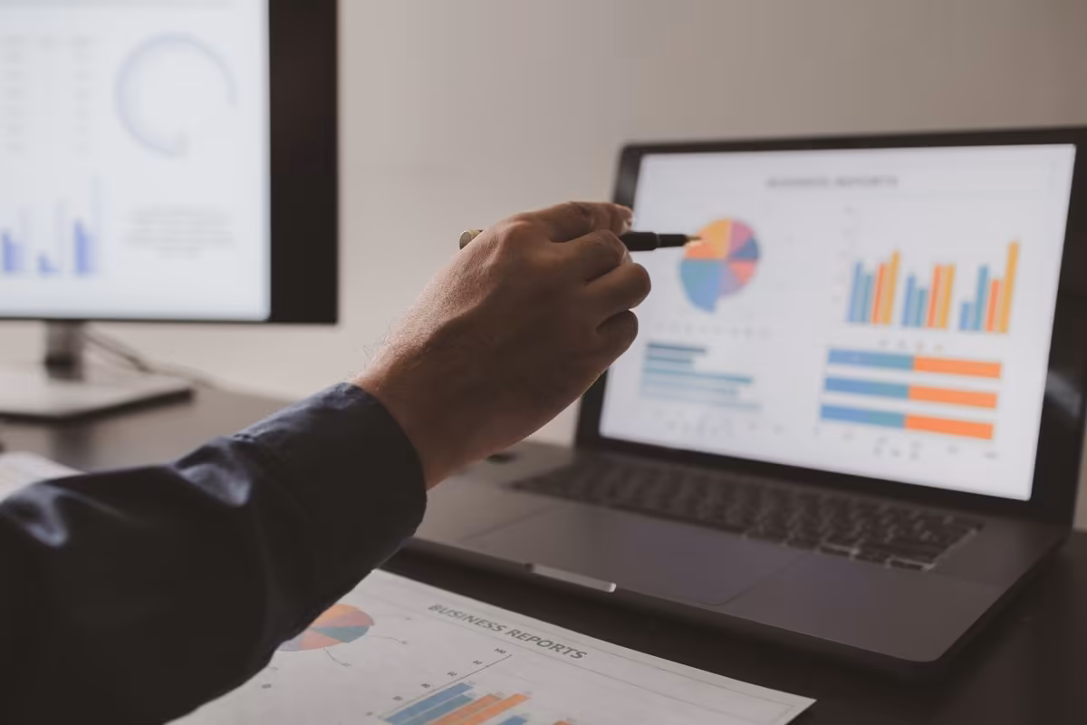 Marketing performance review with charts and reports at Qreative