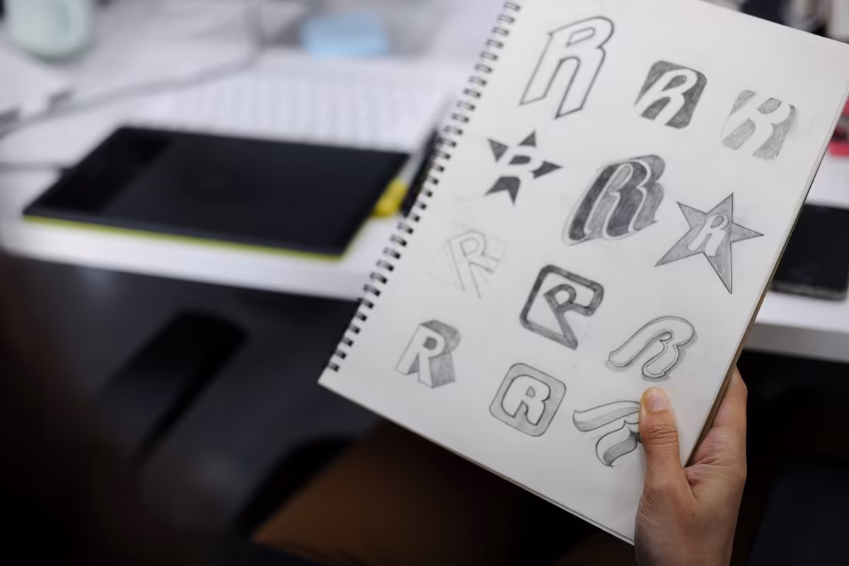 Logo sketches in progress for a visual identity by Qreative