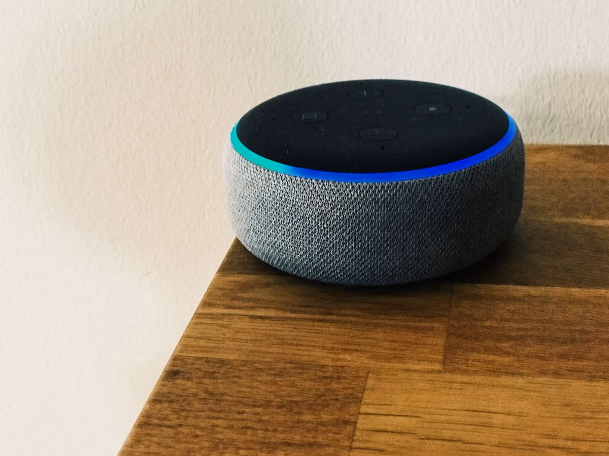Qreative shows an Amazon Echo speaker with a blue glow on a table