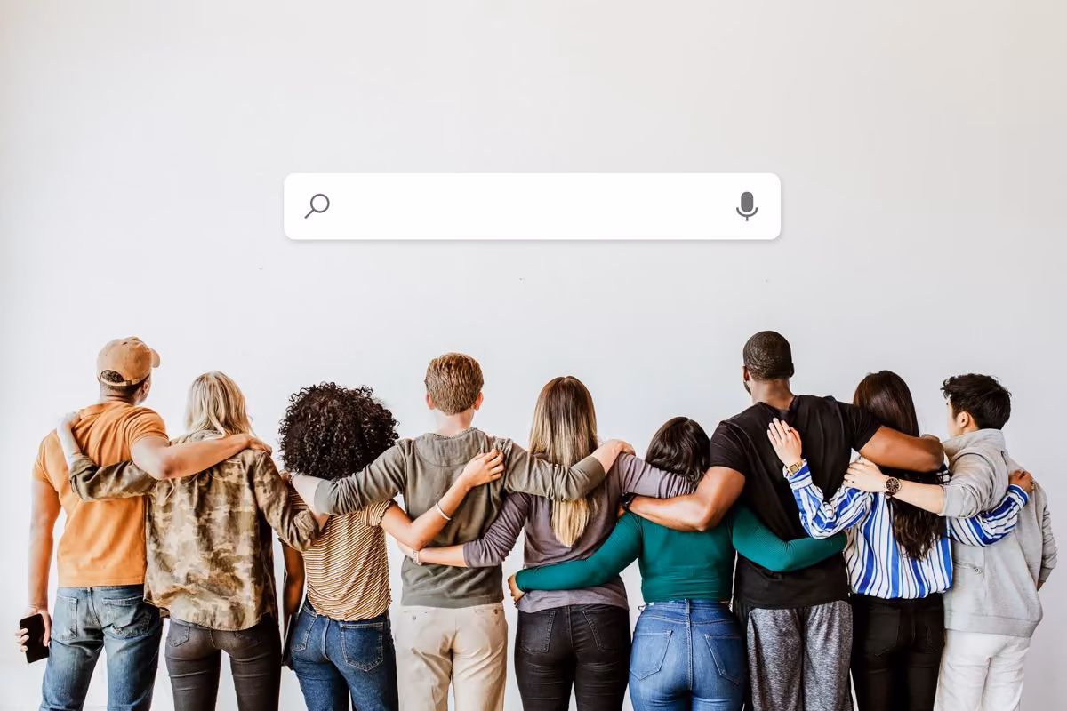 Qreative shows a group gathered beneath a voice search bar